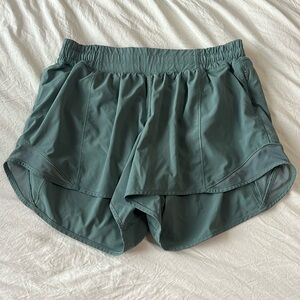 army green lululemon hotty hot shorts!! 4”